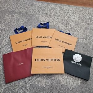 Louis Vuitton, Cartier, and Chanel Shopping Bags